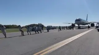 Hundreds of people cheer on plane pull fundraiser