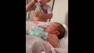 BABY TRYING TO BREAST SISTER WITH ITS OWN BREAST