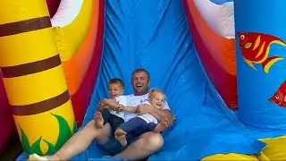 Mike, Emy and dad have fun in the amusement park for kids