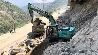 pocklain machine loading soil in dampers&hellip;.
