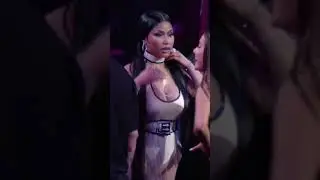 Ariana grande and Nicki Minaj whispering during the MTV awards