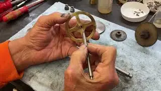 1340.  A bronze bearing inserted into the A1 spring barrel arbor￼ reduces play