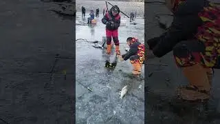 Ice Fishing with Hook to Catch Fish in Frozen Lake