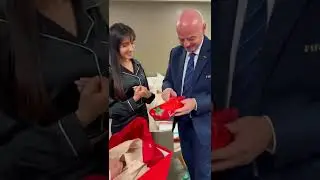 NoraFatehi gifts a custom made pair of sneakers to the president of FIFA,