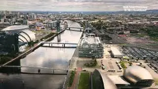 A panoramic view of Glasgow, the Clyde and the landscape beyond.