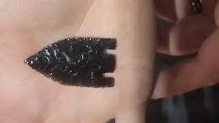 Flintknapping small obsidian arrowhead 