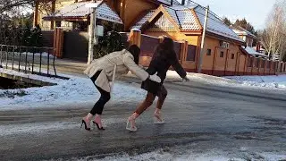 Two sexy models on high heels walking on very slippery ice road, high heels on ice (scene 656)