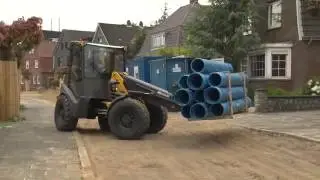 Incarcatoare compacte Mecalac seria AX la constructii de drumuri