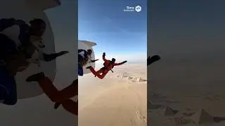 Friends skydiving over Giza Pyramids discussing benefits of AI & Flight