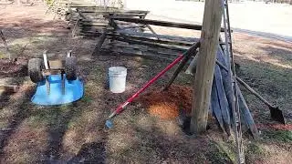 Entry gate posts hole digging in rock hard clay