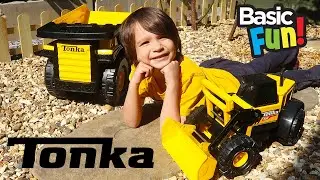 Helping daddy with our Tonka Tough vehicles