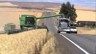 John Deere Combine Unloading On Go - Highway