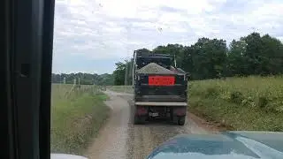 Spreading stone with a dump truck