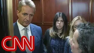Tearful woman confronts Senator Flake on elevator