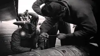 Crewmen work on bomb in dolly near an AJ Savage on the deck of USS Hancock CV-19 ...HD Stock Footage