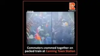 Commuters crammed together on packed train at Canning Town Station
