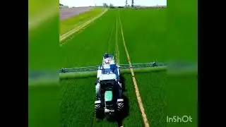 John Deere farm spraying machine spraying a wheat farm#johnderee