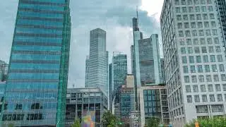 Looking up perspective at glass skyscrapers in Frankfurt's Innenstadt district timelapse. Germany
