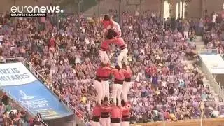 Competitors create huge human tower at Catalan traditional festival