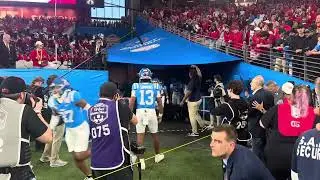 Ole Miss QB Austin Simmons, as he has all season, greets each of his teammates out of tunnel