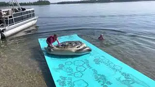 Olivia jumps to puppy blow up from the Maui mat. Sister Harper jumps. Cotton Lake 2021 July 5