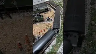 Class 73 pulls intercity past the railway sidings.