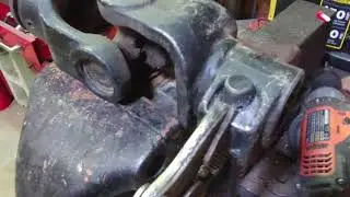 Farmers how to modify the latch pin on a drive shaft to make easy to install on a tractor.