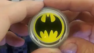 The .9999 Fine Silver Glow in the Dark Bat Signal Coin by the Royal Canadian Mint.