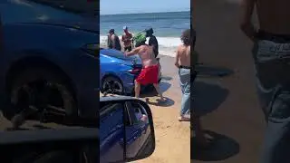 Sports Car Gets Stuck in Sand at Beach - 1439434