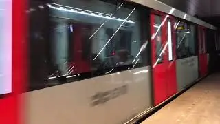 Metro line 52 arrives and departs from metro station Rokin in Amsterdam, Netherlands