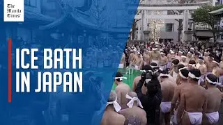 Japanese take plunge in Tokyo shrine's ice bath to pray for New Year