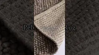 Handwoven 100% wool rug with a textured pebble design, bringing softness and durability to any space