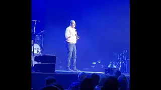 Joshua MacLeod speaking at the Ryman with Sidewalk Prophets