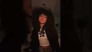 Stylish Woman with Curly Hair Dancing Indoors#curlyhair #dance #fashionstyle #indoorvibes