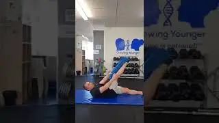 Hamstring stretch with towel for lower back pain