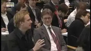 Dutch reporter putting a hard-hitting question to Chancellor Merkel