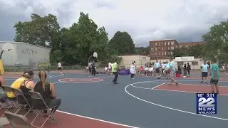 AG Healey plays basketball with Holyoke youth