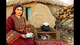 Rural life in Iran; making a clay stove