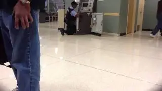 Brinks guard has trouble with ATM.