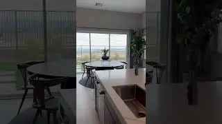 12 foot ceilings never looked so good - also love the waterfall Counter tops