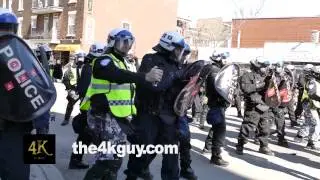 4K UHD - Riot police shooting pepper spray towards crowd of protesters
