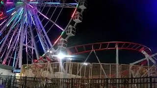 THE FERRIS WHEEL AND ROLLER COASTER TRAIN AT THE STEEL PIER ATLANTIC CITY