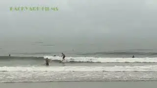 Surfers at Sunset Beach Treasure Island Florida