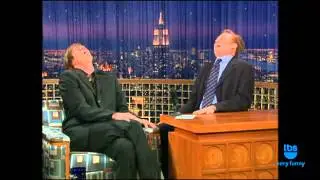 Conan O'Brien and Jim Carrey laugh together