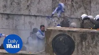 Protesters violently clash with police at Macedonia rally in Athens