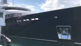 Yacht squeezes through St Martin bridge