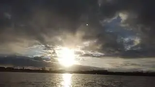 Cold time lapse to an orange glow sunset over lake 1-16-26