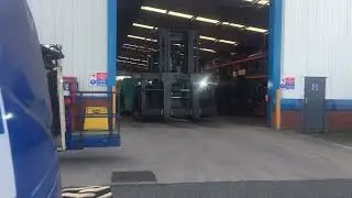 New Konecranes SMV33-1200 forklift coming out of the front door of Advanced Material Handling