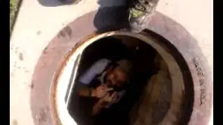 Lanscaper in a manhole
