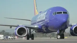 US government sues Southwest, fines Frontier for delayed flights